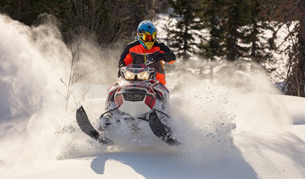 Enjoy adventurous snowmobiling during winter in Missoula. This rider is having the time of their life!