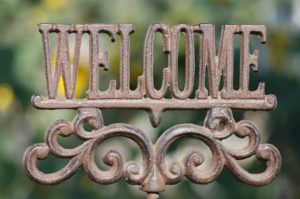 Horizontal image of an iron sign spelling out the word Welcome not found at an Airbnb Missoula rental