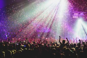 View of rock concert show in big concert hall with crowd and stage at Missoula concerts