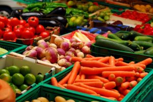 fresh assorted vegetables in boxes at a Missoula Farmers Market