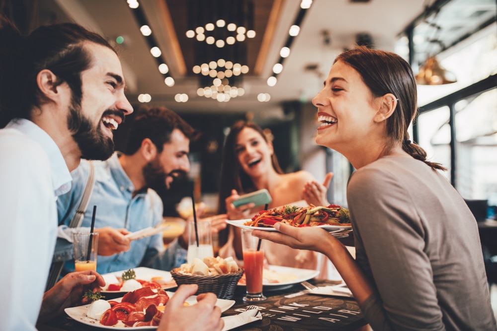 A group of friends enjoying a delicious meal at the best Missoula restaurants