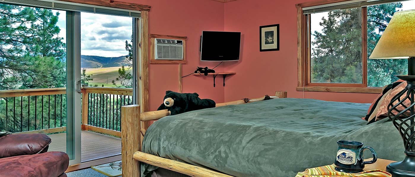 A cozy guest room at our Inn overlooking the valley, the perfect place to relax after visiting the Missoula Art Museum