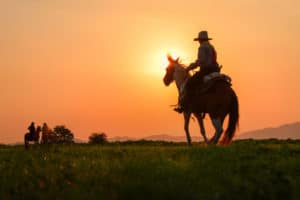 A cowboy at Sunset - similar to scenes shot at Yellowstone Filming locations in Montana