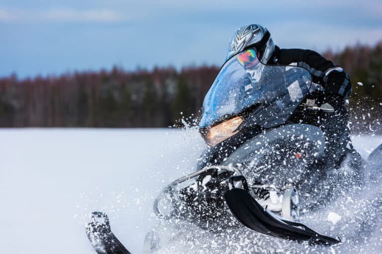 Man enjoying some of the best snowmobiling in Montana near our Missoula Bed and Breakfast