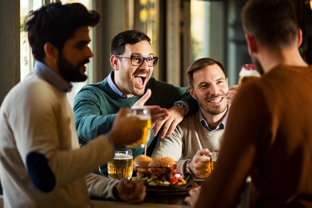 four men dining out and enjoying a beer at local Missoula Restaurants