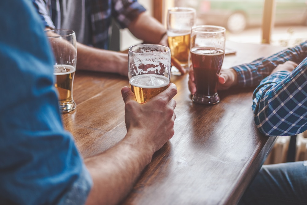 Friends relaxing and enjoy a cold pint at one of the best Missoula breweries