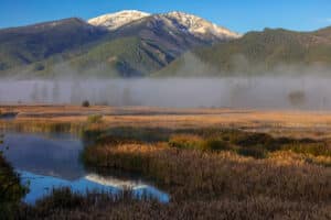 Discover the Lee Metcalf Wildlife Refuge while you're visiting Missoula, Montana. Watch as the mist rises off the wetlands and up along the mountains.