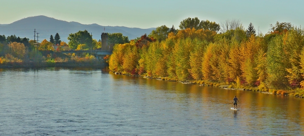 Paddling down the river in Missoula in the fall - one of the best things to do in Missoula other than hiking trails in the Bitterroot Valley