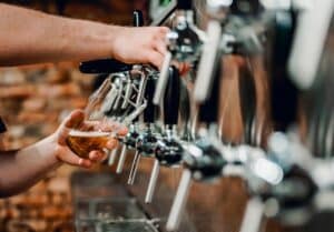 Bartending getting a pint of beer at local Missoula breweries like Big Sky Brewing