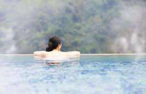 A young woman relaxes at the hot springs near Missoula.