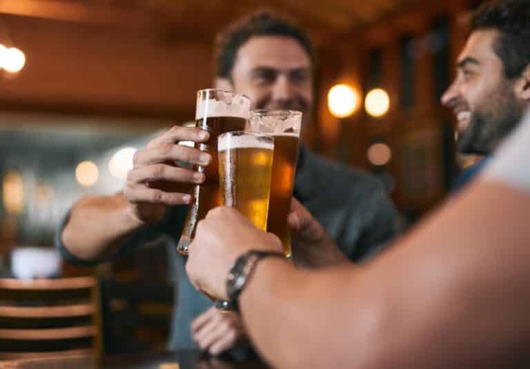 Friends doing a cheers at one of the top Montana breweries in Missoula