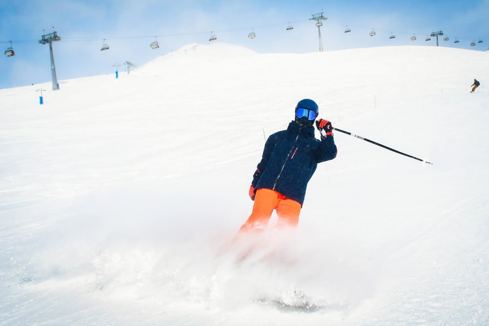 Experience Epic Missoula Skiing and Winter Fun 4 Have fun with Missoula skiing at the Missoula Snowbowl this season! Skier with chairlift in the background.