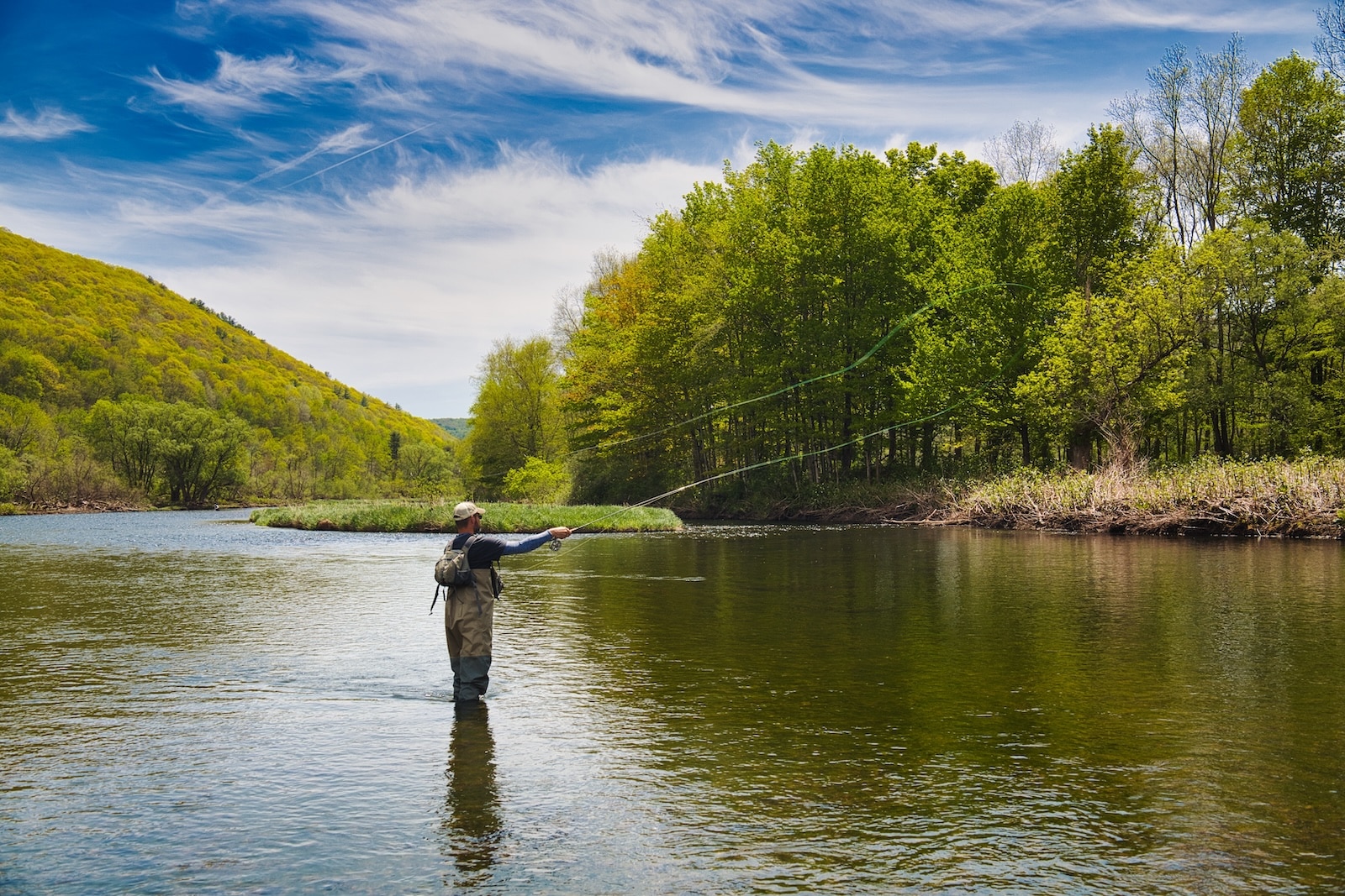 The Absolute Best Things to Do in Missoula, Montana 1 A day spent fly fishing is one of the exciting things to do in Missoula, Montana for outdoorsmen. Here is aman fly fishing in a river.
